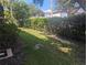 Landscaped backyard with a hedge and grass at 2912 S Semoran Blvd # 9, Orlando, FL 32822