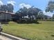 Landscaped grounds with residential buildings in the background at 2912 S Semoran Blvd # 9, Orlando, FL 32822