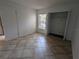 Bright bedroom featuring tile floors and a closet at 2912 S Semoran Blvd # 9, Orlando, FL 32822