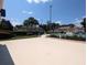 View of a community pool with palm trees and buildings at 2912 S Semoran Blvd # 9, Orlando, FL 32822