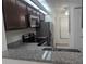 Modern kitchen with stainless steel appliances and granite countertops at 2912 S Semoran Blvd # 9, Orlando, FL 32822