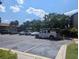 Parking lot with several cars parked and a service truck at 2912 S Semoran Blvd # 9, Orlando, FL 32822