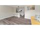 Open concept kitchen and living area with modern appliances and vinyl flooring at 127 Oyster Bay Cir # 110, Altamonte Springs, FL 32701