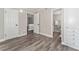 Bright bedroom with wood-look vinyl flooring and access to bathroom and closet at 127 Oyster Bay Cir # 110, Altamonte Springs, FL 32701