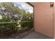 Screened patio with lush landscaping offering a peaceful view at 127 Oyster Bay Cir # 110, Altamonte Springs, FL 32701
