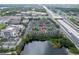 Aerial view showing the condo complex by a lake at 127 Oyster Bay Cir # 110, Altamonte Springs, FL 32701