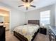 Cozy bedroom with a queen-size bed and en-suite bathroom at 1152 Mattie Pointe Blvd, Auburndale, FL 33823