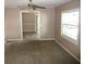 Bright living room with carpet flooring and ceiling fan at 896 N 9Th St, Eagle Lake, FL 33839