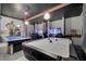 Game room with pool table, air hockey, and gaming stations at 1536 Maidstone Ct, Davenport, FL 33896