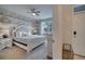 Main bedroom with a king-size bed and water view at 1536 Maidstone Ct, Davenport, FL 33896