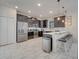 Modern kitchen with stainless steel appliances and ample counter space at 1536 Maidstone Ct, Davenport, FL 33896