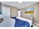 Main bedroom with a king-size bed, dresser and large TV at 1536 Maidstone Ct, Davenport, FL 33896