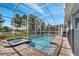 Enjoy this refreshing pool and spa with a screened enclosure at 1536 Maidstone Ct, Davenport, FL 33896