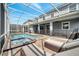Resort-style pool and spa with screened patio and lounge chairs at 1536 Maidstone Ct, Davenport, FL 33896