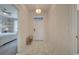 Bright entryway with tile floors and view of bedroom at 1536 Maidstone Ct, Davenport, FL 33896