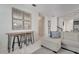 Living room with sectional sofa and a wooden console table with bar stools at 1536 Maidstone Ct, Davenport, FL 33896