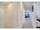 Upstairs hallway with carpet and doors to bedrooms and a game room at 1536 Maidstone Ct, Davenport, FL 33896