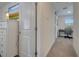 Bright hallway with white doors and carpeted floor at 1536 Maidstone Ct, Davenport, FL 33896