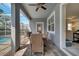 Relaxing patio with table and chairs, near the pool at 1536 Maidstone Ct, Davenport, FL 33896