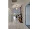 Hallway with marble tile floors and view of living room at 1536 Maidstone Ct, Davenport, FL 33896