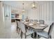 Formal dining room with dark wood table and gray chairs at 1536 Maidstone Ct, Davenport, FL 33896