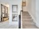 Modern staircase with dark wood railing and neutral carpet at 1536 Maidstone Ct, Davenport, FL 33896
