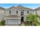 Two story house with a two car garage at 1536 Maidstone Ct, Davenport, FL 33896