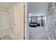 Small bathroom with a shower/tub combo and white tile at 1536 Maidstone Ct, Davenport, FL 33896