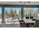 Covered patio overlooks a sparkling pool with a screened enclosure at 1536 Maidstone Ct, Davenport, FL 33896