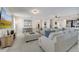 Spacious living room with large sectional sofa and a large TV at 1536 Maidstone Ct, Davenport, FL 33896