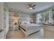 Bedroom with wood-like wallpaper and a king bed at 1536 Maidstone Ct, Davenport, FL 33896