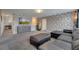 Spacious game room with sectional sofa and large TV at 1536 Maidstone Ct, Davenport, FL 33896