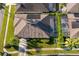 Property with solar panels and private pool, viewed from above at 2918 Sunset Retreat Ct, Kissimmee, FL 34747