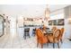 Kitchen with granite counter tops, white cabinets, and breakfast bar at 2918 Sunset Retreat Ct, Kissimmee, FL 34747