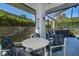 Relaxing screened patio with table and chairs, overlooking a hot tub at 2918 Sunset Retreat Ct, Kissimmee, FL 34747