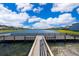 Community dock offering serene lake views and peaceful fishing opportunities at 2918 Sunset Retreat Ct, Kissimmee, FL 34747