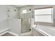 Updated bathroom featuring a walk-in shower and soaking tub at 621 Knightsbridge Cir, Davenport, FL 33896