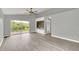 Spacious living room featuring built-in shelving and backyard access at 621 Knightsbridge Cir, Davenport, FL 33896