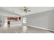 Bright living room with hardwood floors and sliding glass doors leading to backyard at 621 Knightsbridge Cir, Davenport, FL 33896