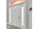 Bright entryway with a neutral color palette and modern door at 621 Knightsbridge Cir, Davenport, FL 33896