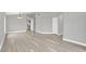 Open dining room with gray walls, wood-look floors and chandelier at 621 Knightsbridge Cir, Davenport, FL 33896