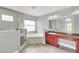 Modern bathroom with a large walk-in shower and soaking tub at 621 Knightsbridge Cir, Davenport, FL 33896