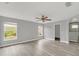 Large main bedroom with hardwood floors and access to en-suite bathroom at 621 Knightsbridge Cir, Davenport, FL 33896