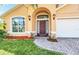 Brick walkway leading to a charming front door at 621 Knightsbridge Cir, Davenport, FL 33896