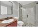 Modern bathroom with updated vanity, toilet and a frameless glass shower at 621 Knightsbridge Cir, Davenport, FL 33896
