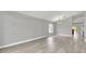 Spacious dining room with gray walls, wood-look floors, and a chandelier at 621 Knightsbridge Cir, Davenport, FL 33896