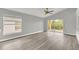 Open living area with hardwood floors and access to backyard patio at 621 Knightsbridge Cir, Davenport, FL 33896