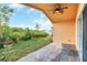 Brick paved patio with ceiling fan, overlooking backyard at 621 Knightsbridge Cir, Davenport, FL 33896