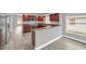 Modern kitchen with dark wood cabinets, granite counters, and stainless steel appliances at 621 Knightsbridge Cir, Davenport, FL 33896