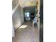Bright entryway with tile floors and view into living room at 1816 Stargazer Trl, Kissimmee, FL 34758